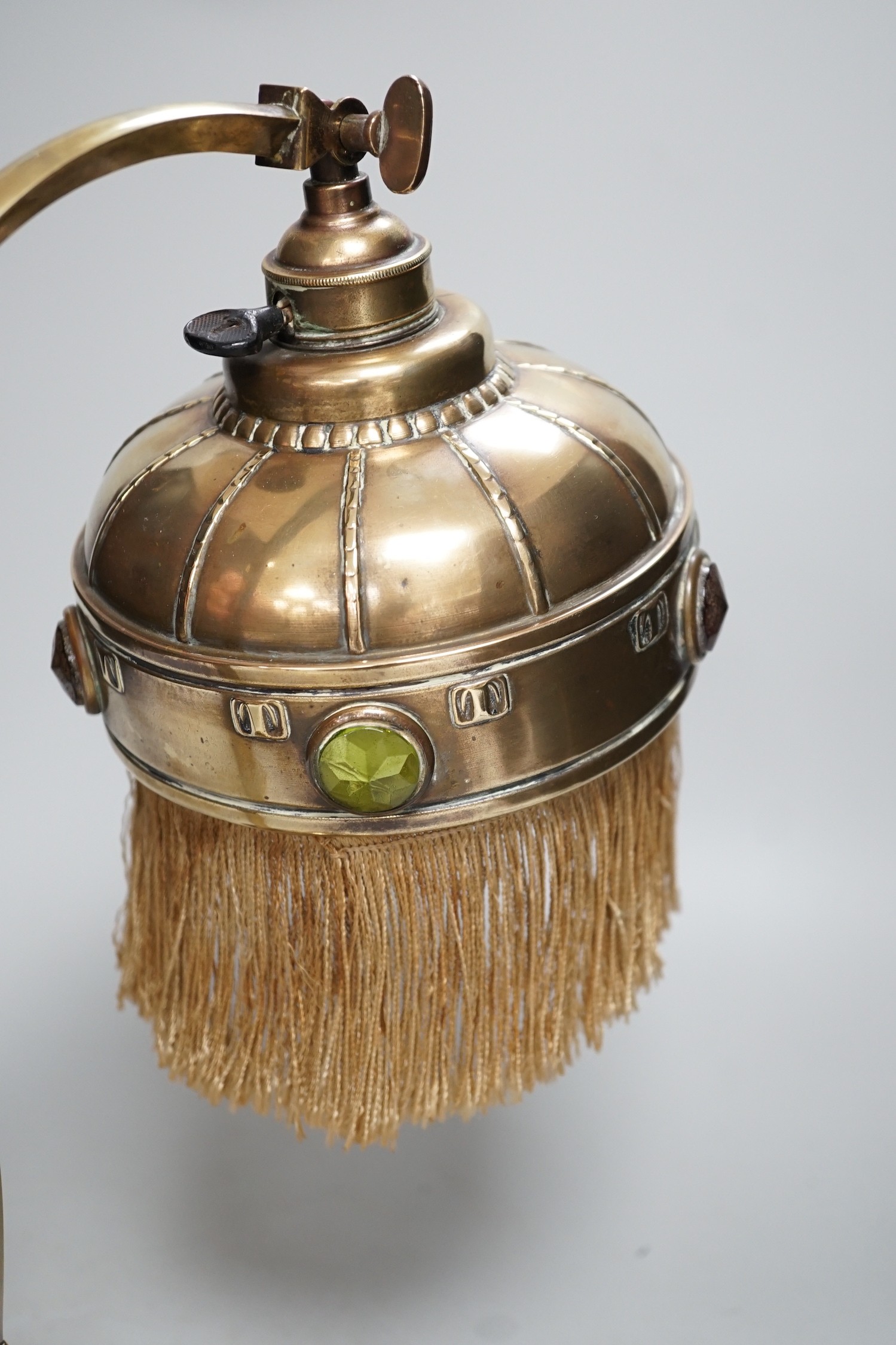 An adjustable Arts and Crafts brass and ‘jewelled’ table lamp, 34cm